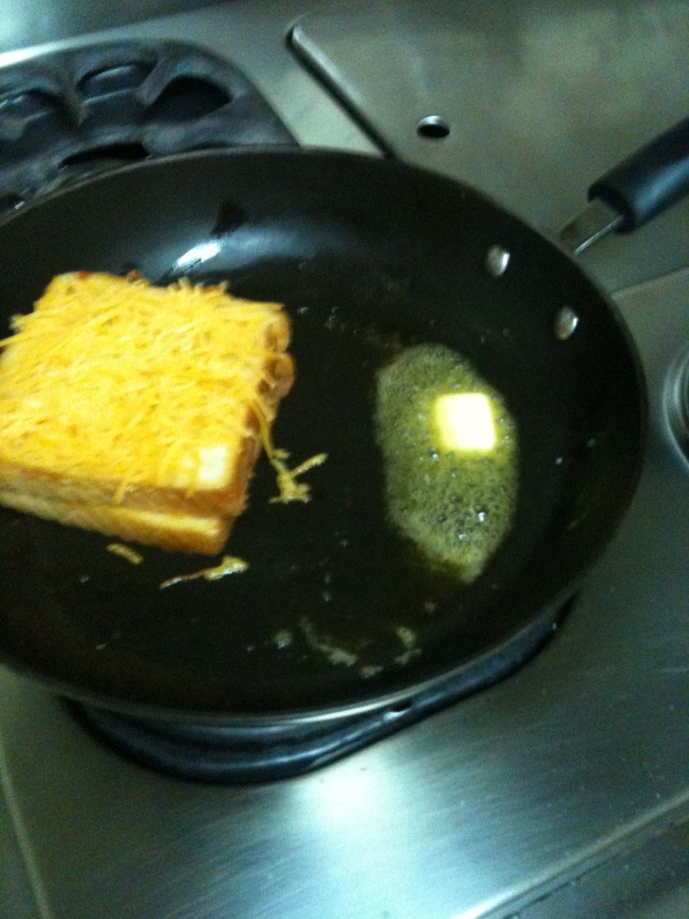 Add cheddar on top, more butter