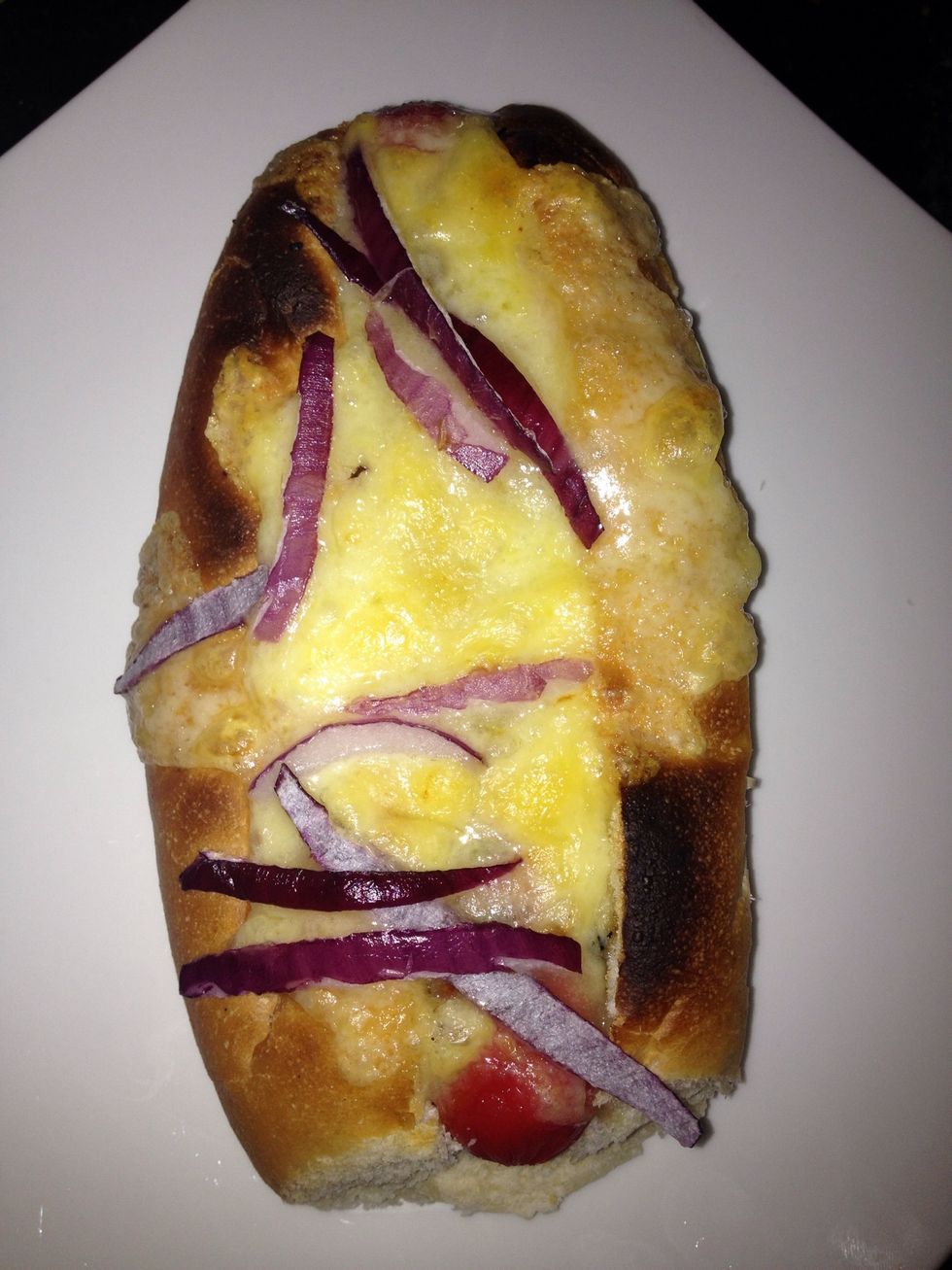 Add cheese and sliced red onion and grill