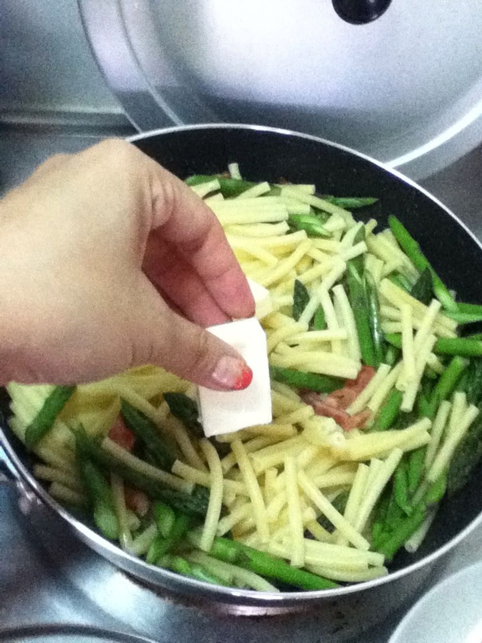 Add cheese!! If you like it really cheesy I guess you can add more. Adjust how much milk and cheese to put as you like, but don't put too much milk, I made a mistake once and the sauce was too watery.