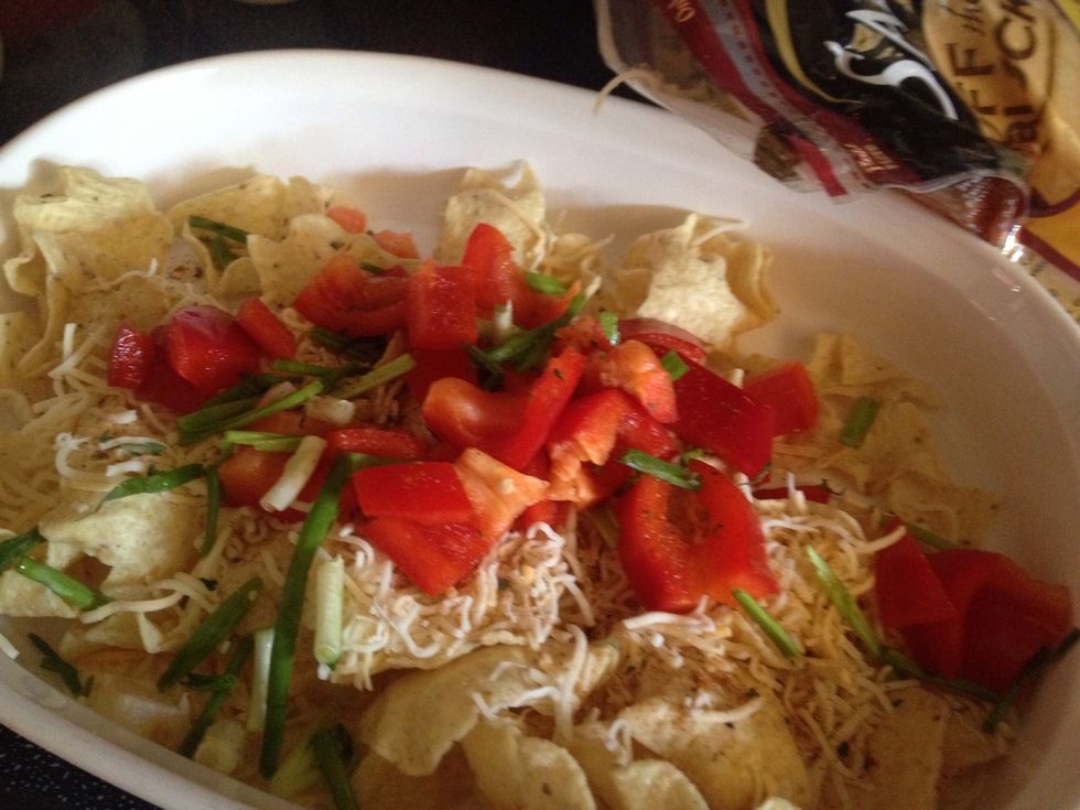 Add cheese on top with a dash of paprika, cumin, and parsley