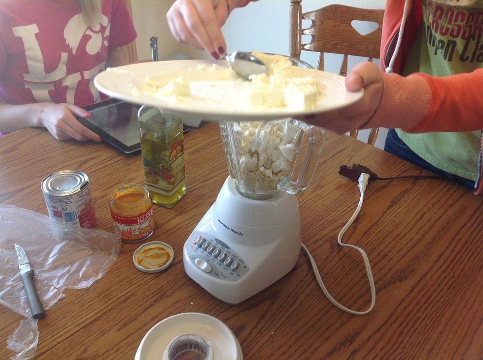 Add cheese to blender.
