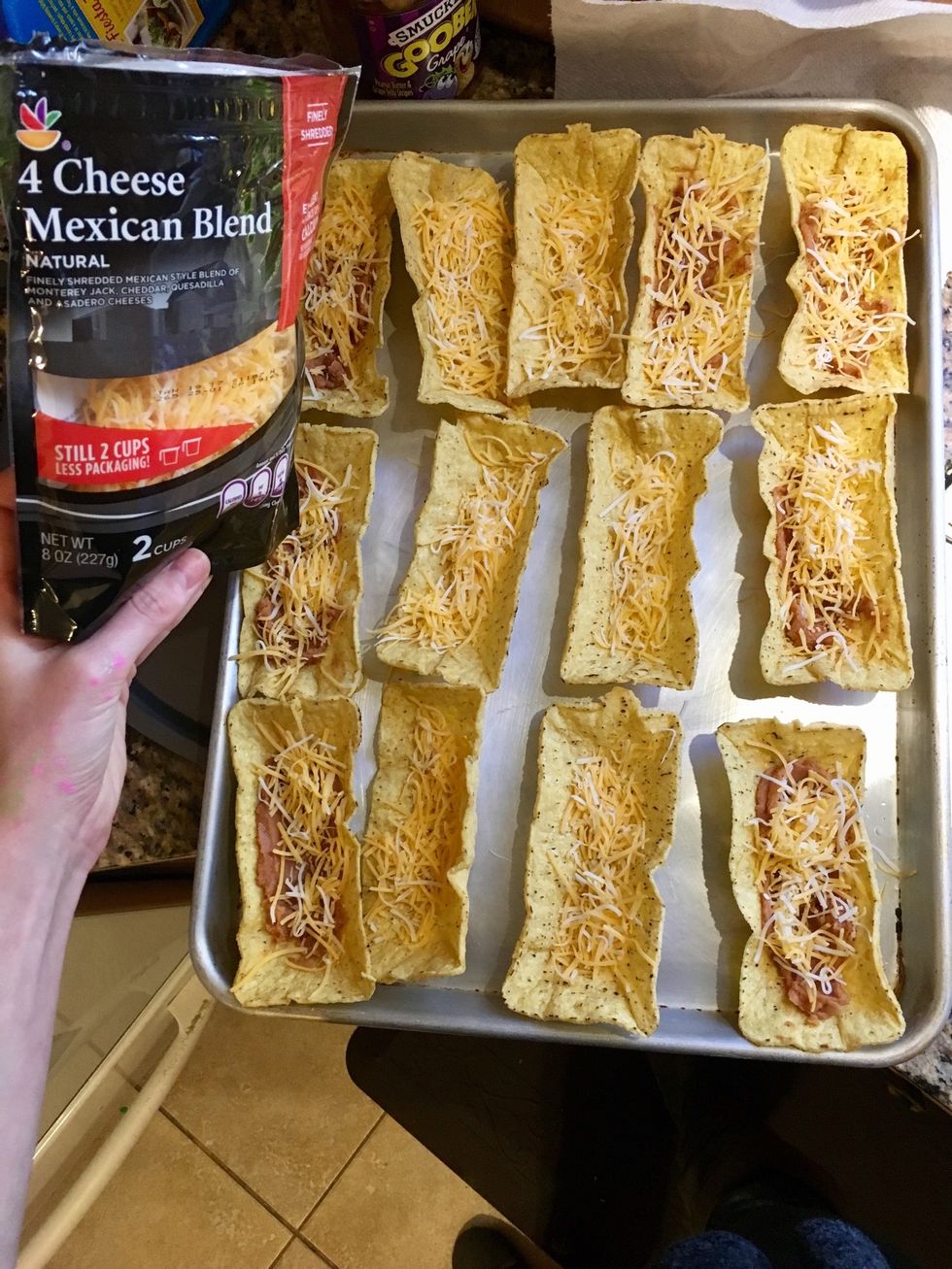 Add cheese to them all.  (I didn't put refried beans on all of them bc some people don't like beans)