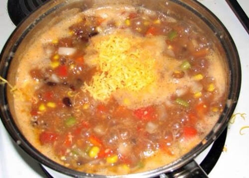 Add cheese to thicken, I used a hunk of cheddar I had in the fridge but feel free to use whatever strikes your fancy. Add a few teaspoons of lime juice.