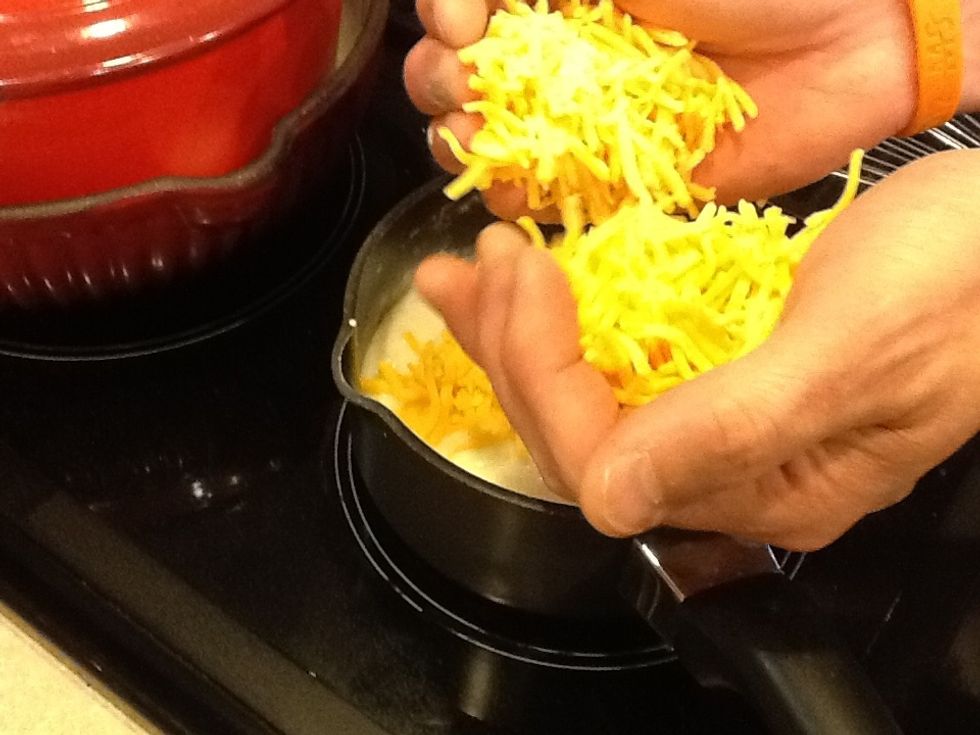 Add cheese to thickened milk