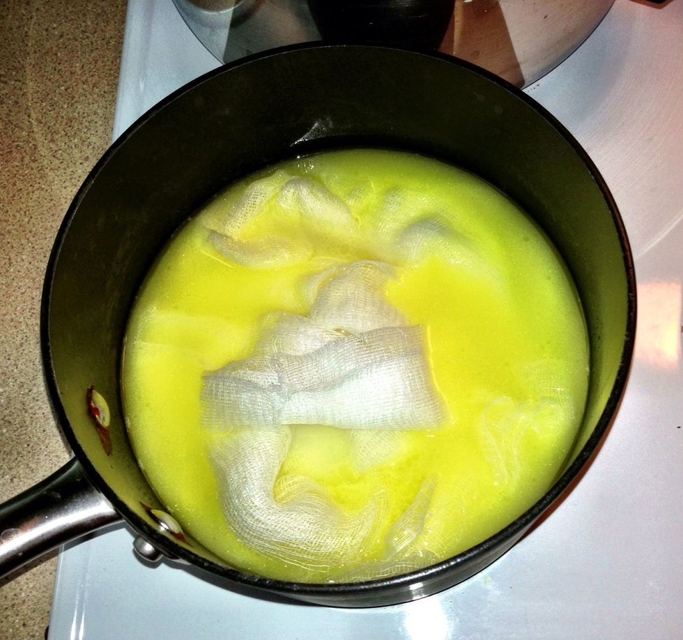 Add cheesecloth to the wine and butter mixture.