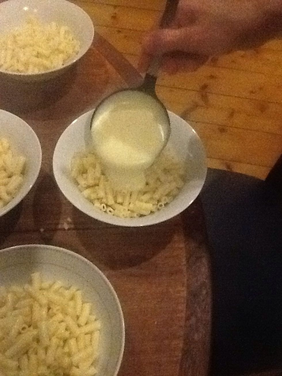 Add cheesy sauce over pasta