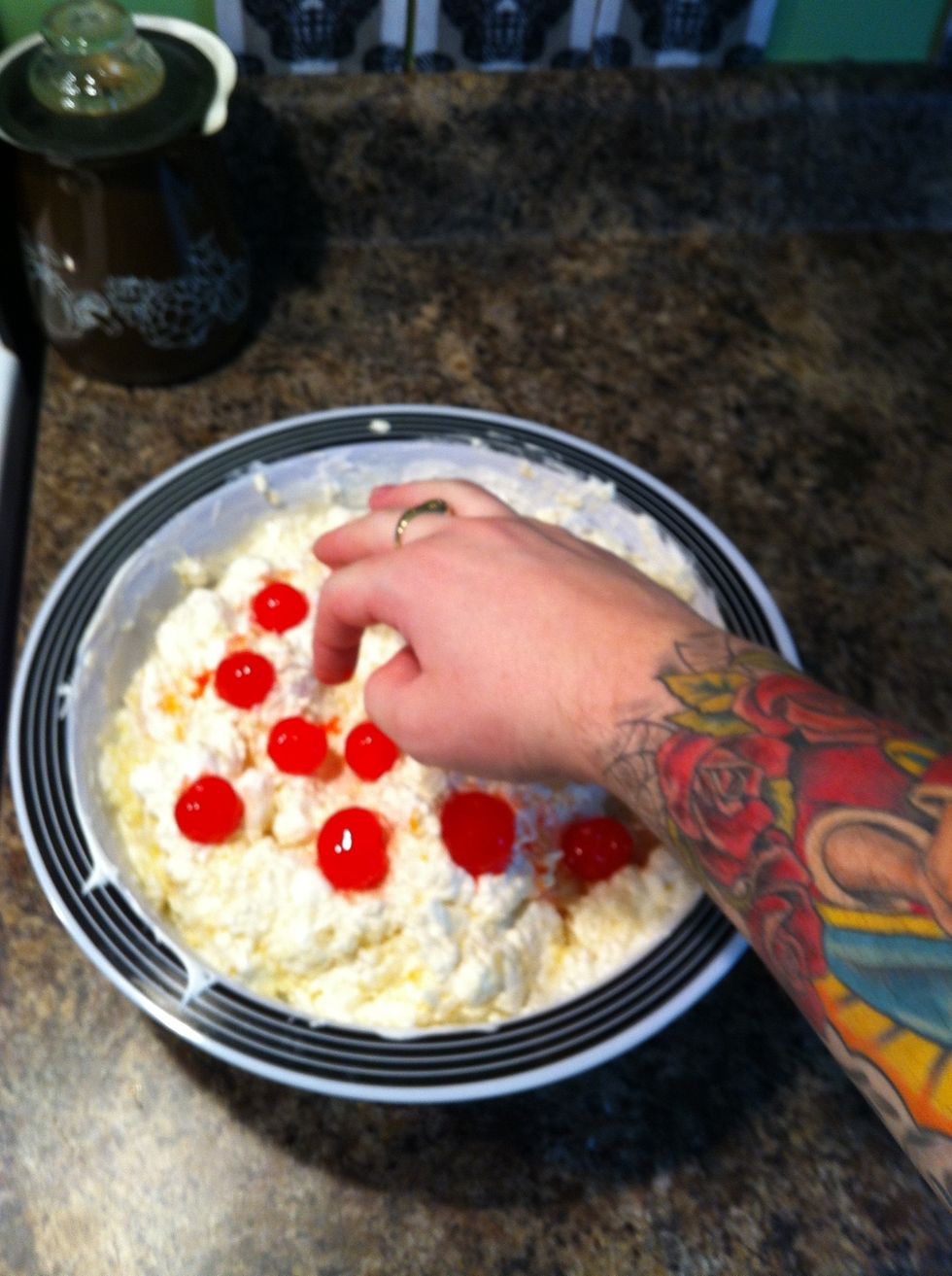 Add cherries to the top