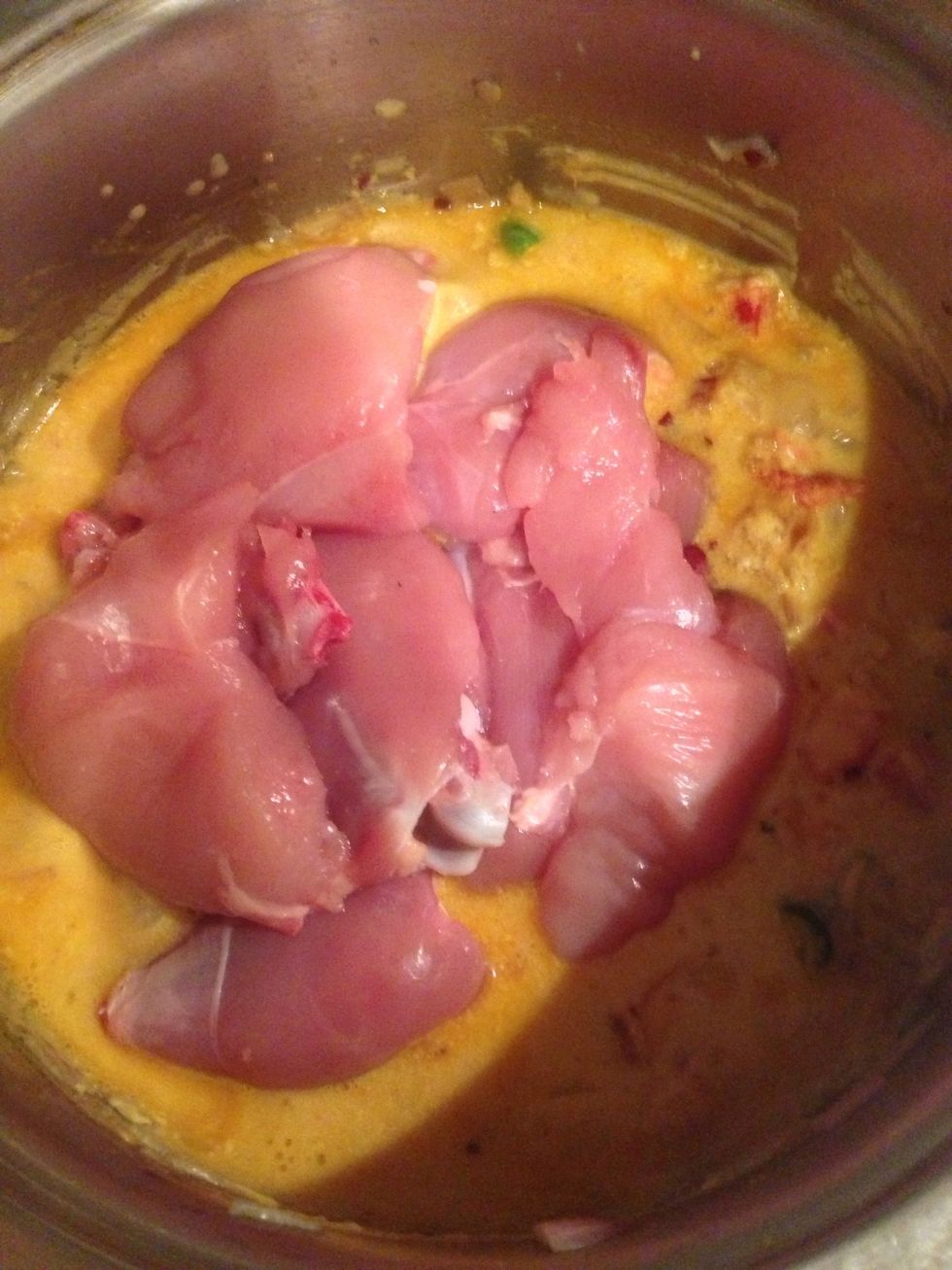 Add chicken and let it cook over low heat.