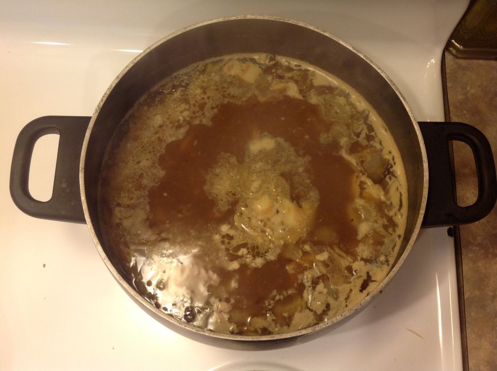 Add chicken bouillon and water to the pot and heat until it starts to boil.