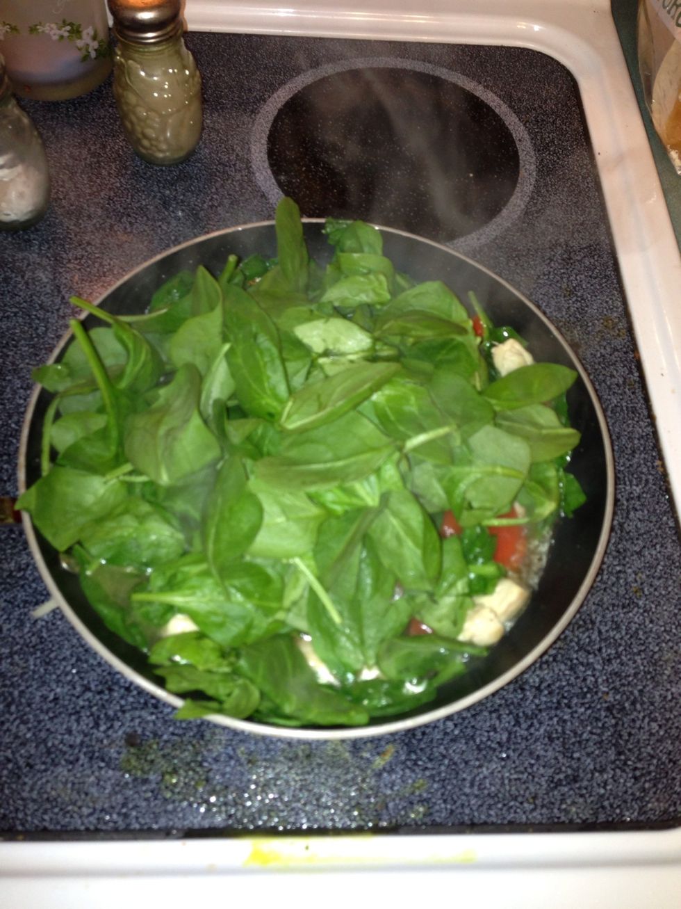 Add chicken broth, roasted peppers, spinach. Simmer for about ten minutes.