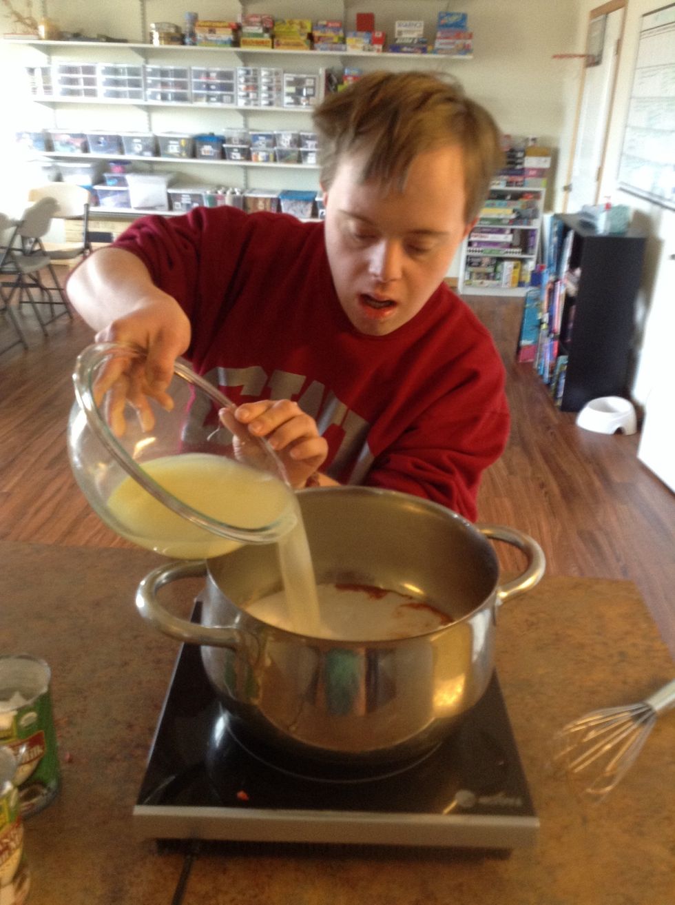 Add chicken broth to pot