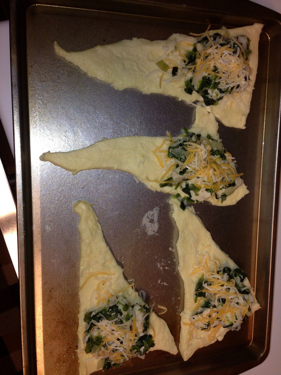 Add chicken mixture & top with more cheese.