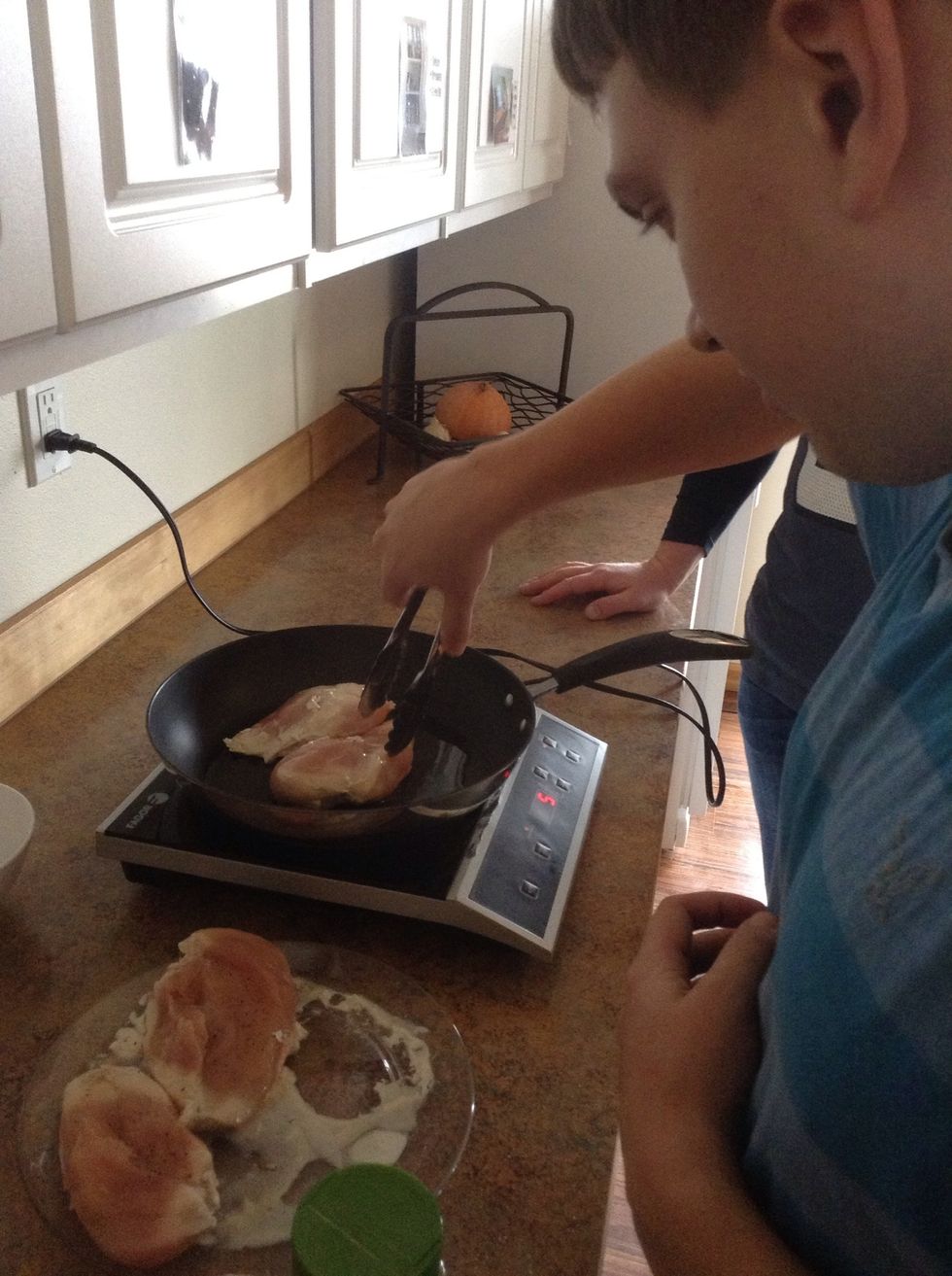 Add chicken to skillet seasoned side down