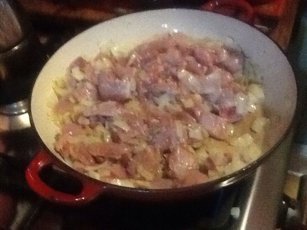 Add chicken to the onion mix and fry to golden brown.