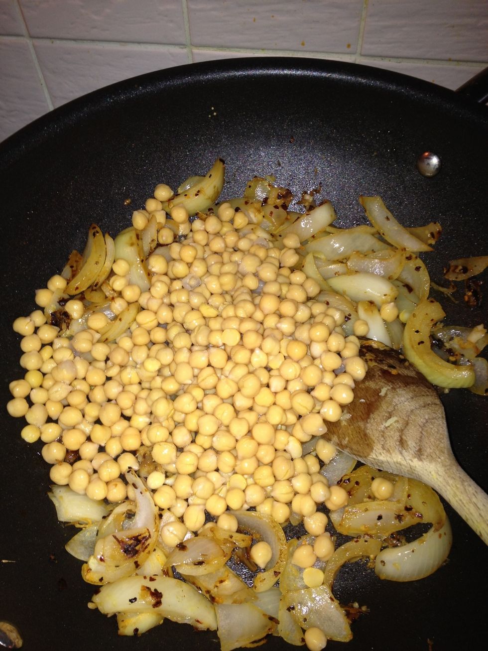 add chickpeas to mix, stir. add some water to prevent drying out and sticking, not too much.