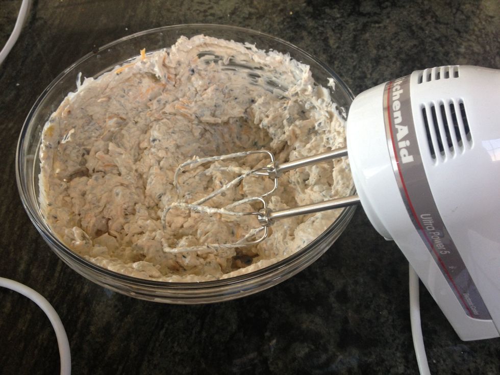 Add chilies, olives and shredded cheese to mixture.