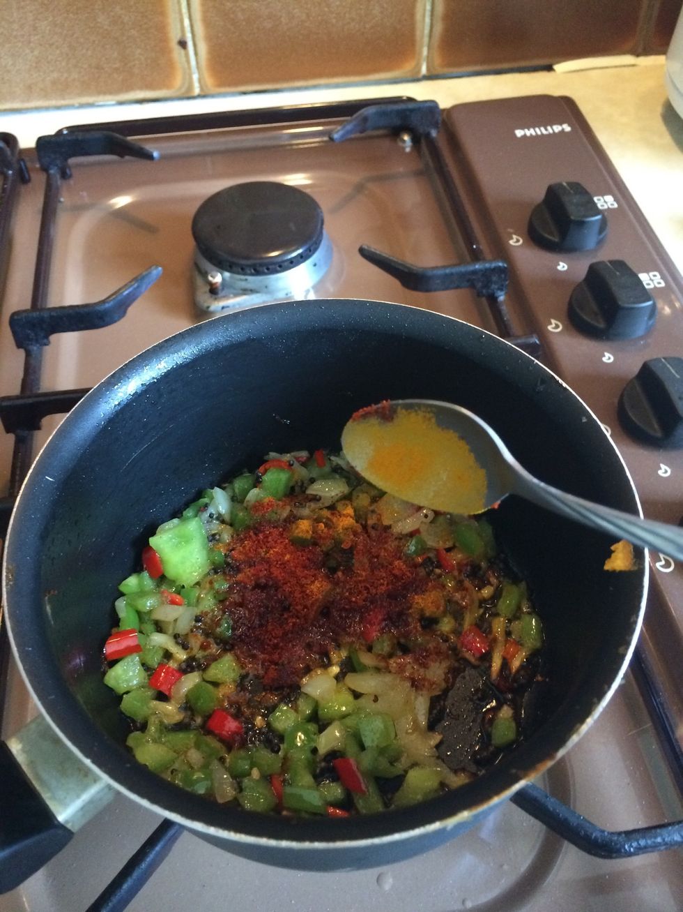 Add Chilli powder, turmeric and salt to taste