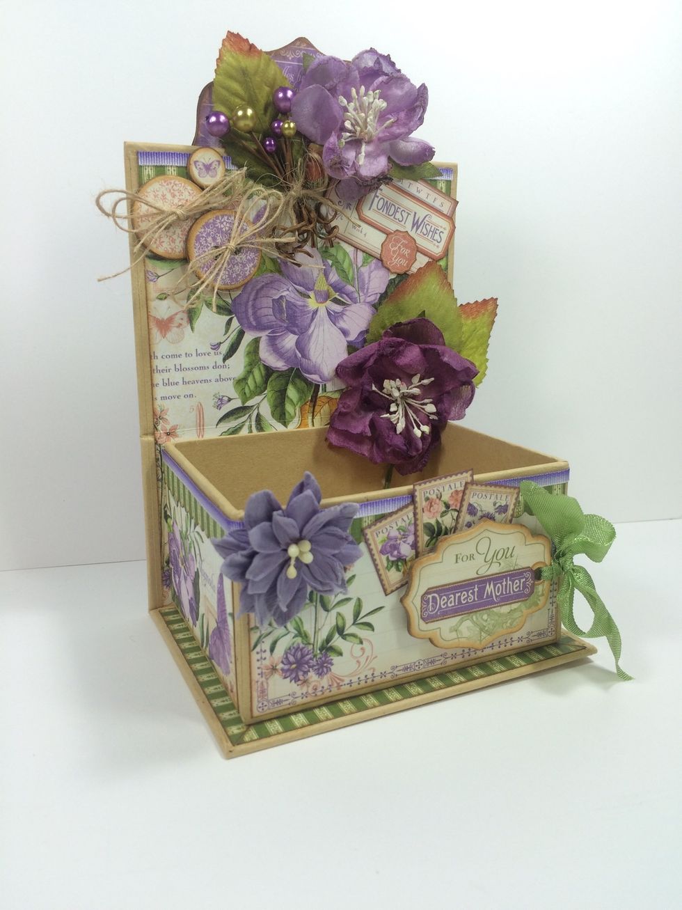 Add chipboard buttons and more purple flowers. I used Petaloo Botanica Blooms and Dahlias - Tea-Stained Purples.