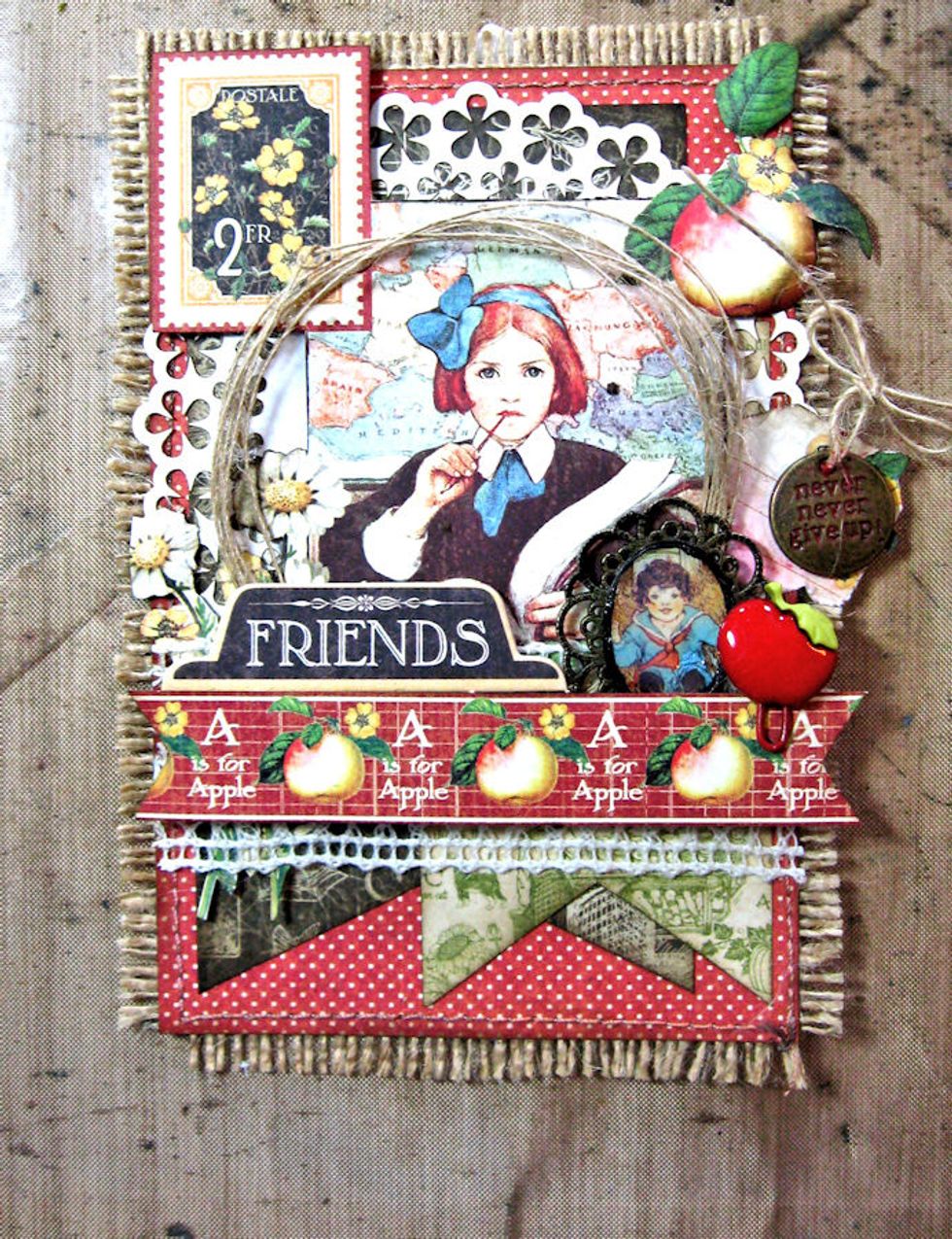 Add chipboard title above border. Attach sentiment charm to small tag with burlap. Tuck behind image as seen here.