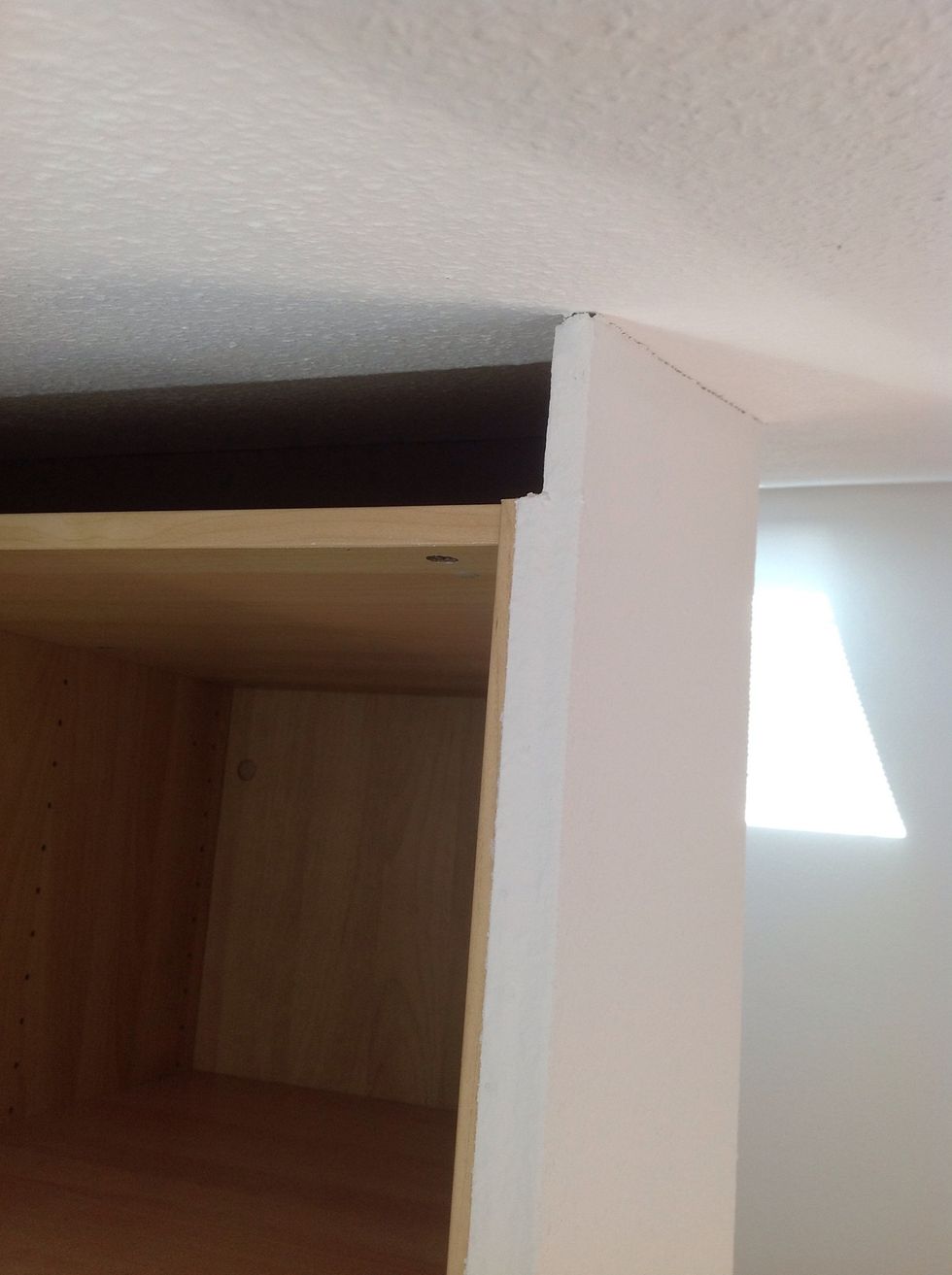Add chipboard to the wardrobe and put wallpaper on it. Paint it in whatever Color you like - your landlord won't mind because ist can be easily removed.