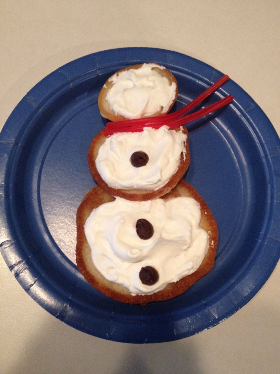 Add chocolate chips for buttons.