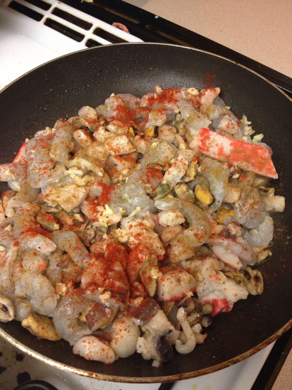 Add chopped garlic, and added salt, pepper, cumin, and paprika.