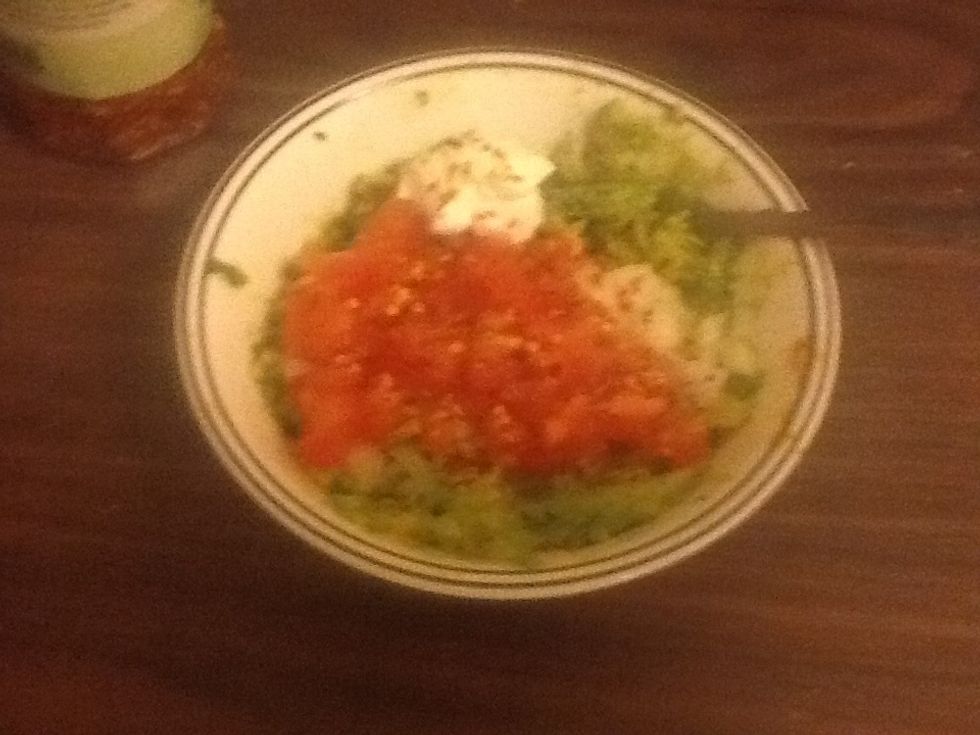 Add chopped onion, cilantro, lime/lemon, one teaspoon sour cream, salt and pepper