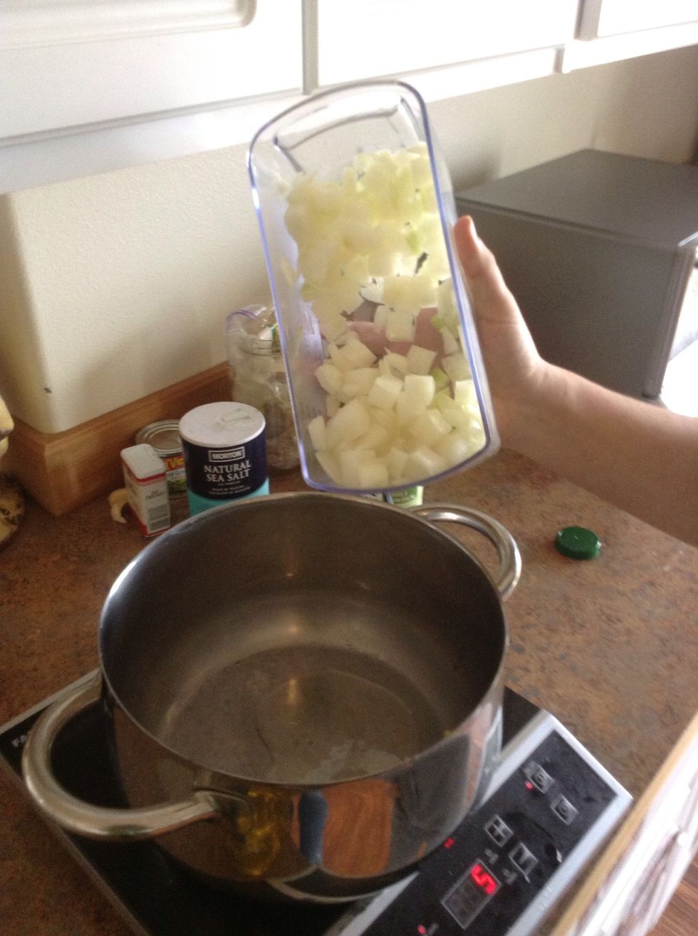 Add chopped onions to coconut oil
