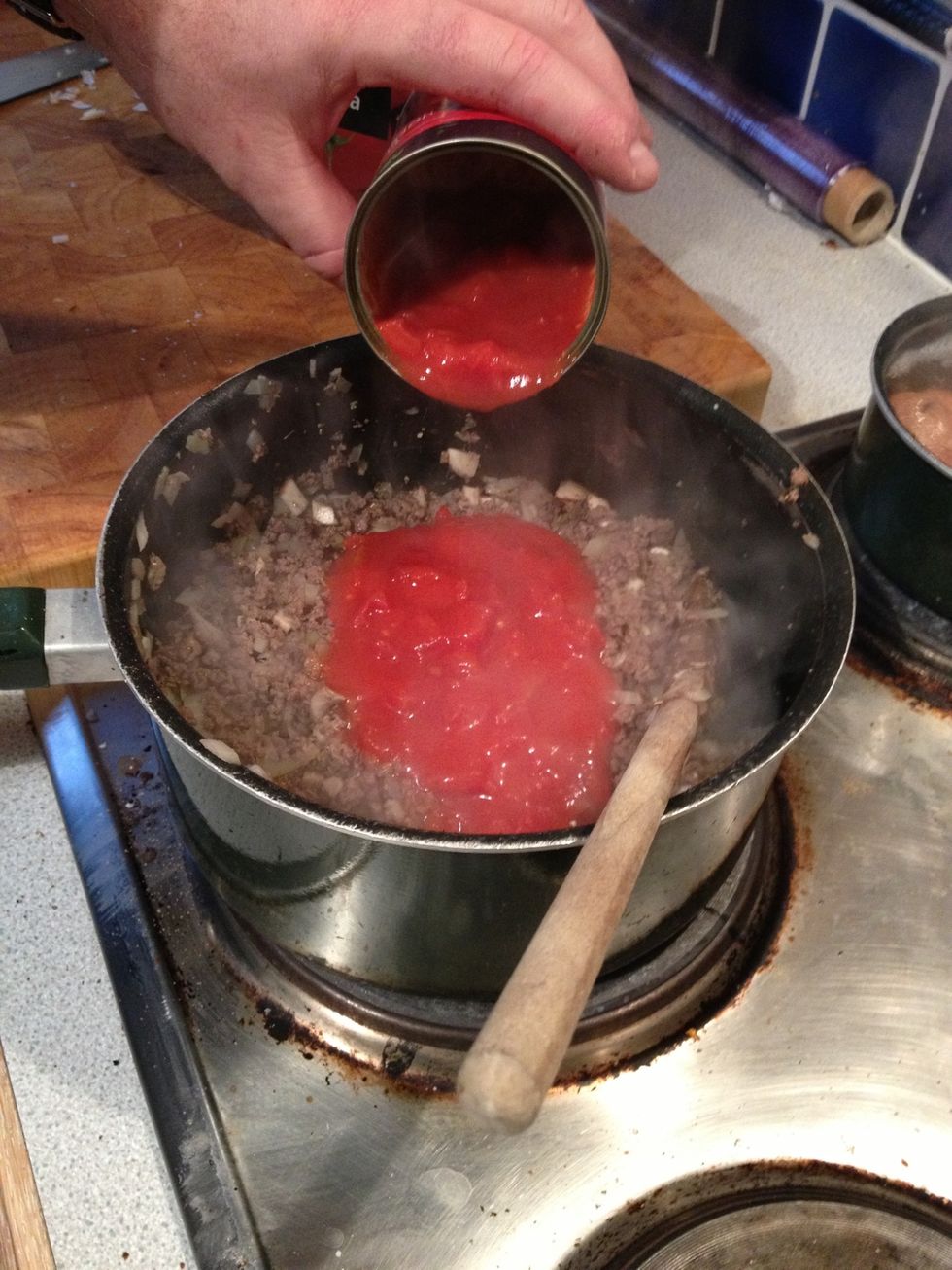 Add chopped tinned tomatoes, and 500g of passatta