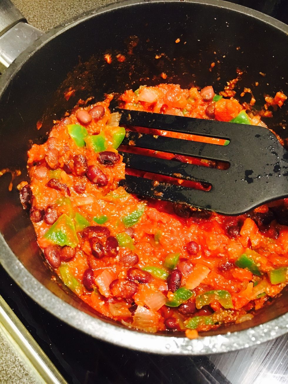 Add chopped tomatoes, black beans and homemade taco seasoning. Mix well and let simmer on low-medium heat for 5 minutes.