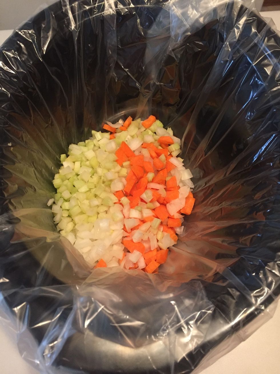 Add chopped veggies to crockpot. I use a crockpot liner for easy cleanup.