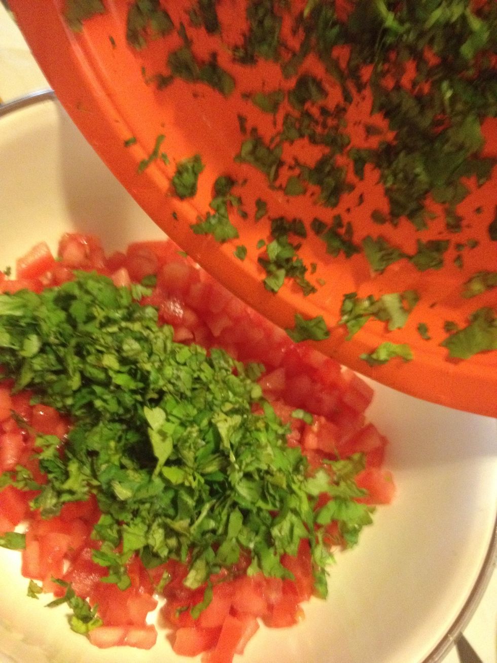 Add cilantro to the diced tomatoes.