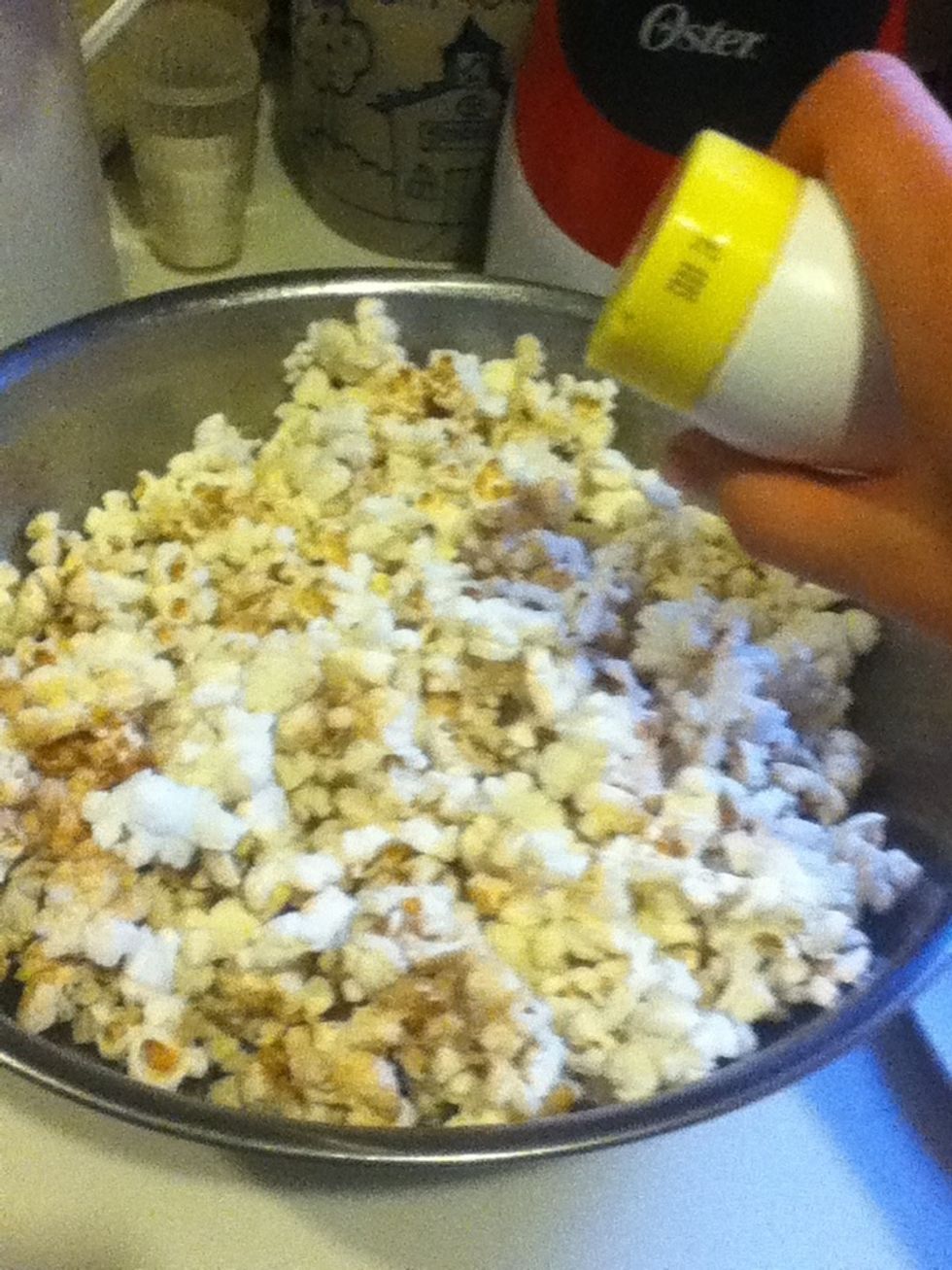 Add cinnamon sugar to the popcorn