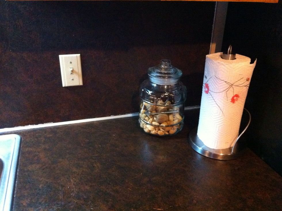 Add clean Paper Towel Holder in corner with Decorative Food. Simple but Nice.