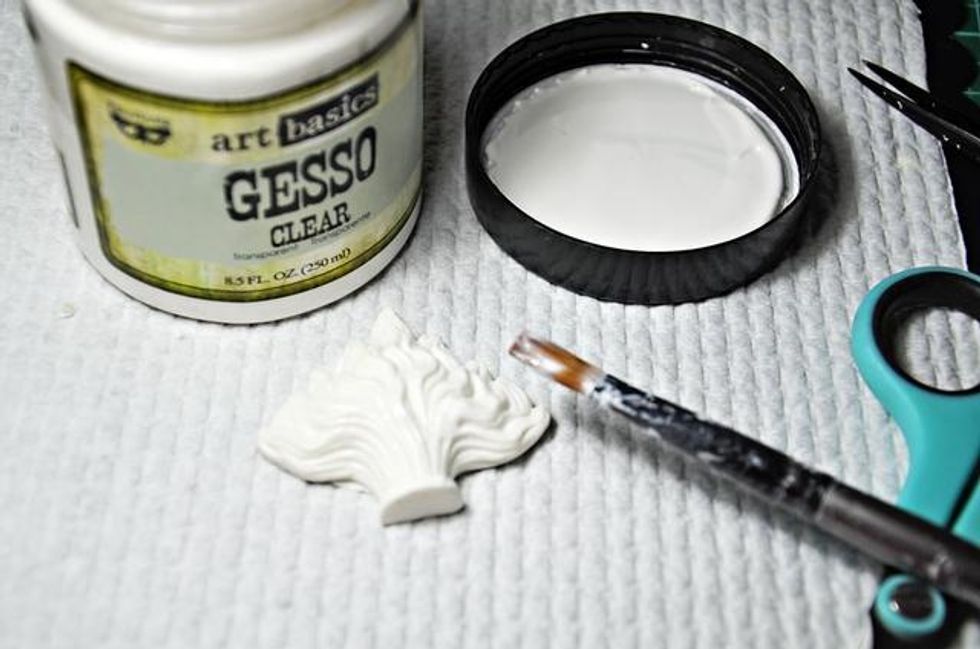 Add clear gesso to the large flame, as well as the small flaming heart, from the Relics and Artifacts Flaming Hearts set.