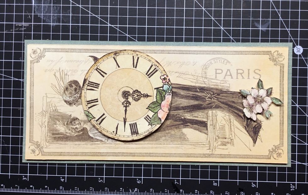 Add clock and small flower piece as shown.