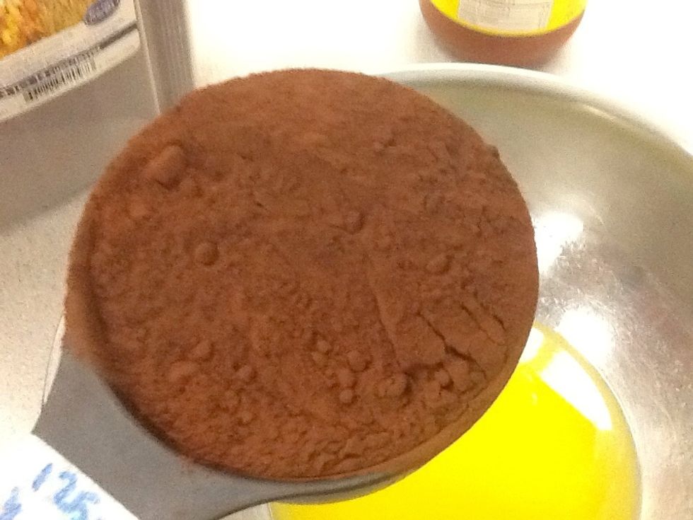 Add cocoa with butter in bowl.