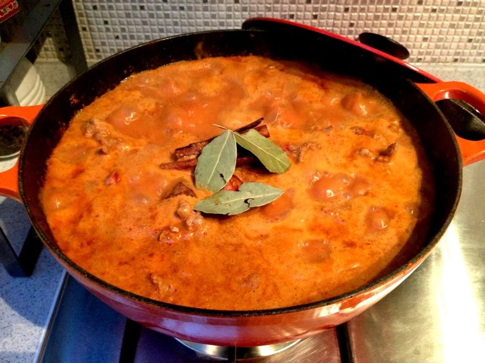 Add coconut cream, bay leaves and cinnamon sticks. Allow to boil for 30-40mins or until juice is reduced by 1/2. Add the cloves & half the desiccated coconut. Continue stirring.