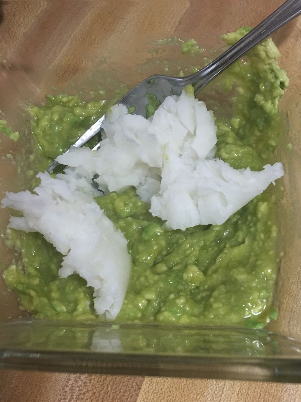 Add coconut oil and continue mashing the ingredients.