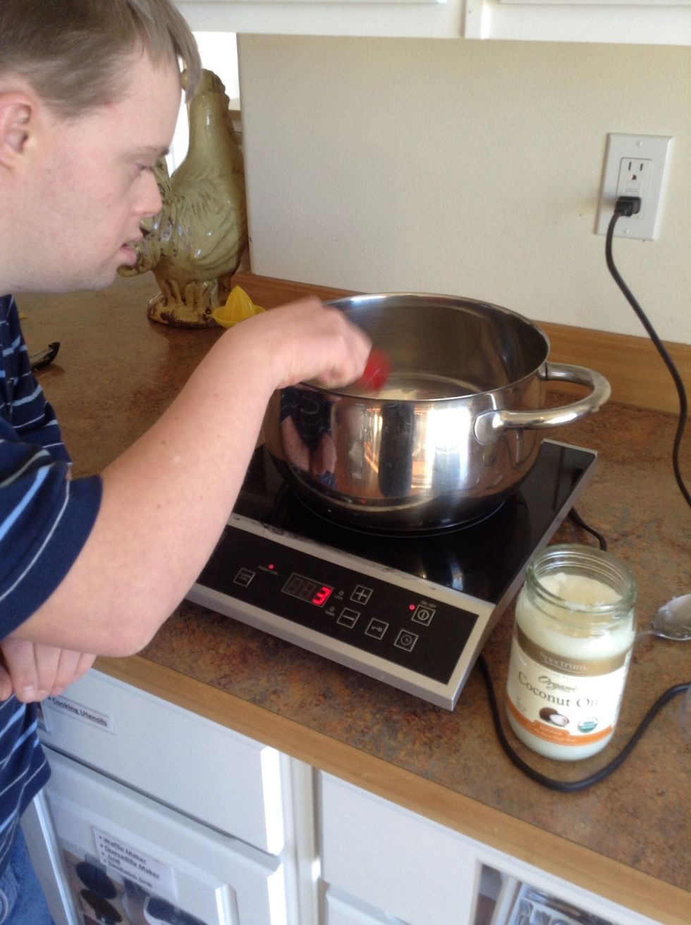 Add coconut oil to pot and let melt