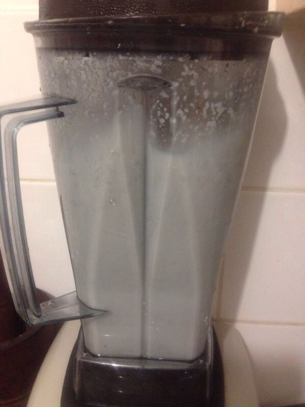 Add coconut water and water to equal 4 cups of liquid to blender. Blend for 1 1/2-2 mins on a high speed to combine.