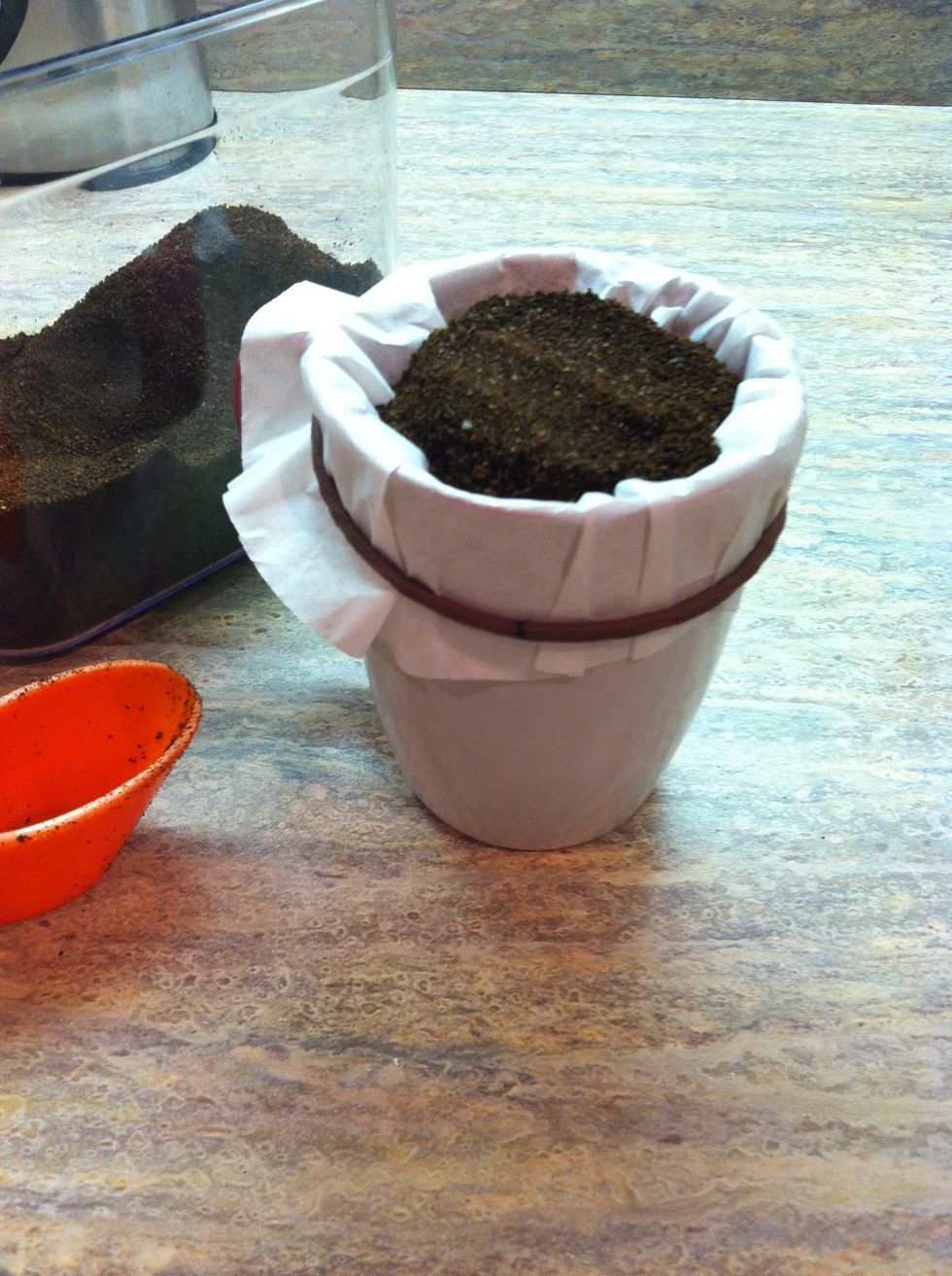 Add coffee grounds on top of the filter