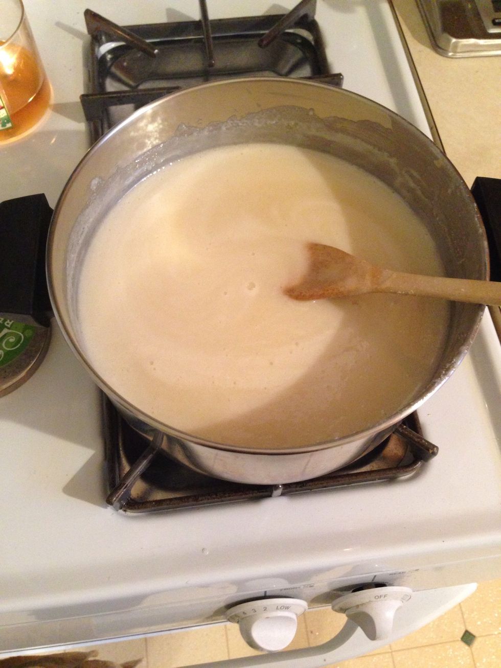 Add condensed milk and dessert spoon syrup. Let boil for about 20 minutes on low, stirring occasionally