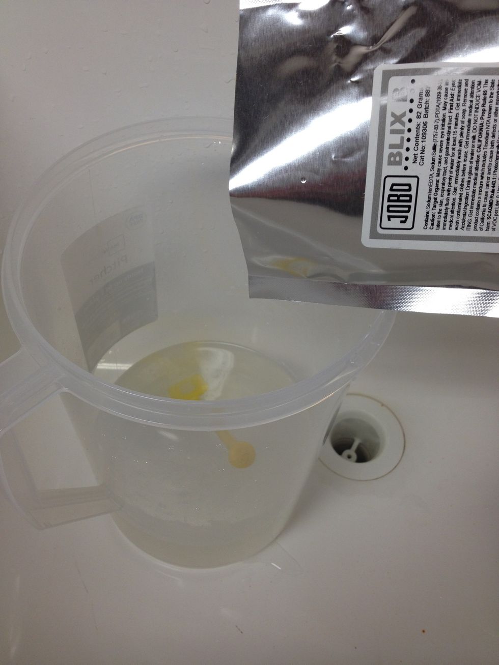 Add contents of Blix B packet while stirring continuously. BE CAREFUL! This part will make the solution very dark and foam up quite a bit. Stir until dissolved.