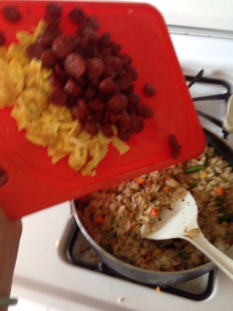 Add cook and sliced sausage and eggs