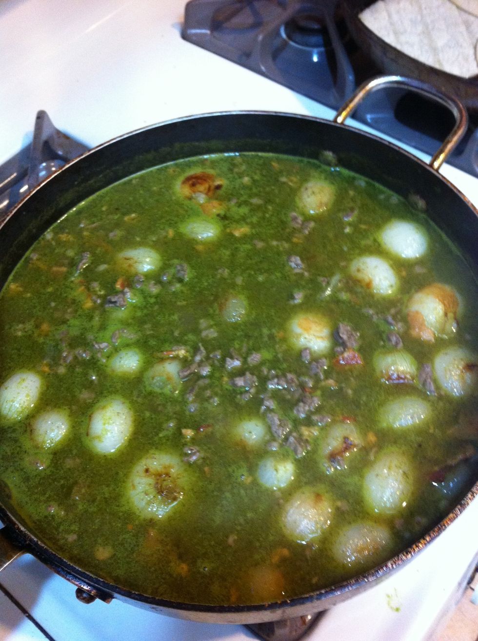 Add cooked onions to the meat, bacon and sauce