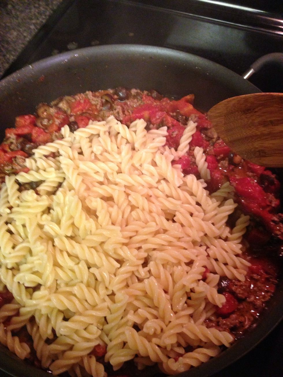 Add cooked pasta and toss to coat