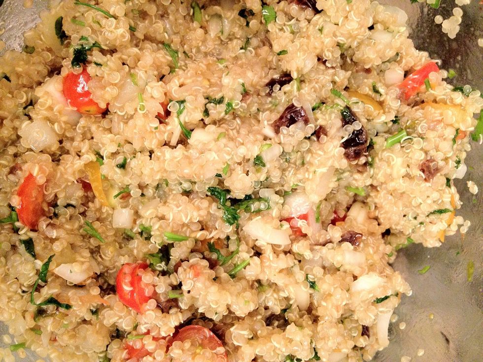 Add cooked quinoa- while still warm- to the bowl of veggie ingredients.