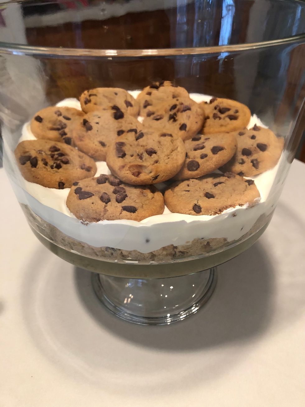 Add cookies on top of the whipped cream.