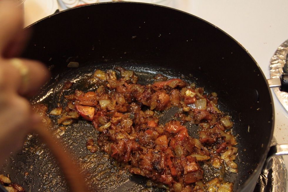 Add coriander powder, chilli powder, turmeric powder, garam masala powder and salt to the pan and fry until the mixture in the pan becomes brown